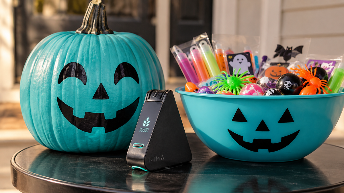 Teal Pumpkin Project display with a pumpkin and bowl of non-food Halloween treats